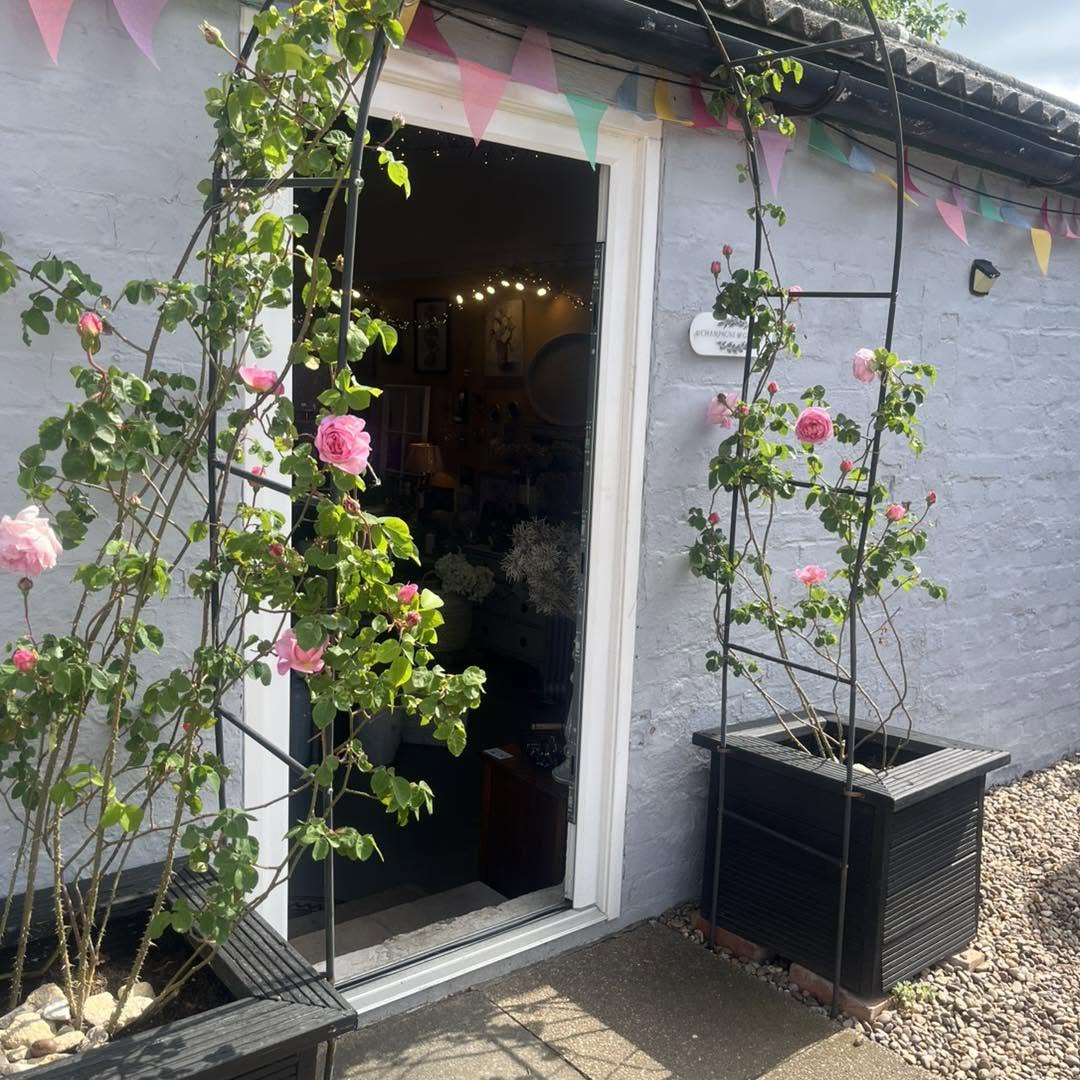 The Champagne & Ginger shop in a converted farm building with open barn doors